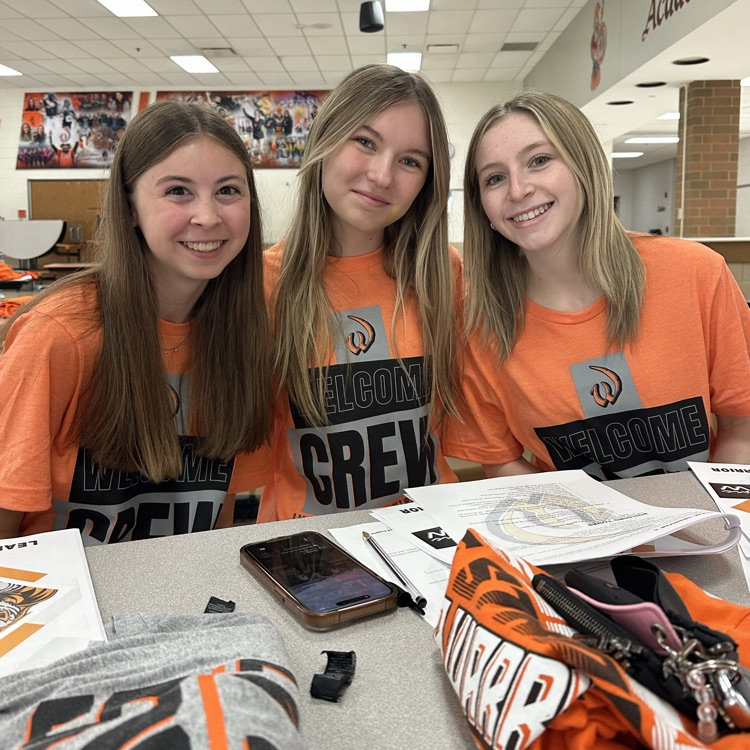 three students posing for photo