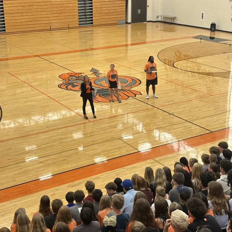 principal presenting to students in gym