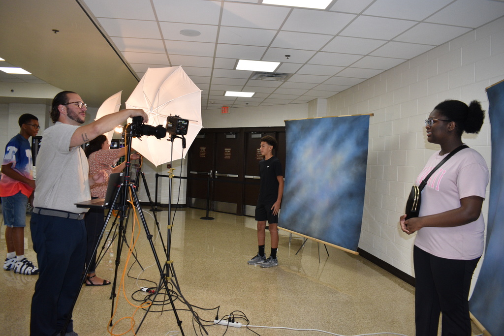 Photographers taking photos of students