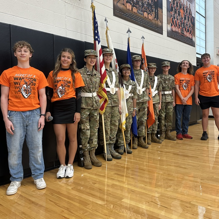 group of students in the main gym prior to the assembly