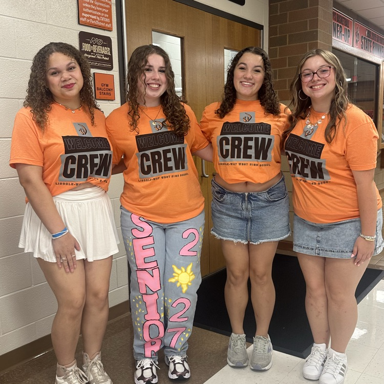 four students from the welcome crew posing for a picture 