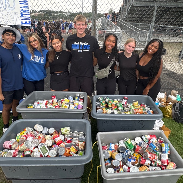 students with canned goods