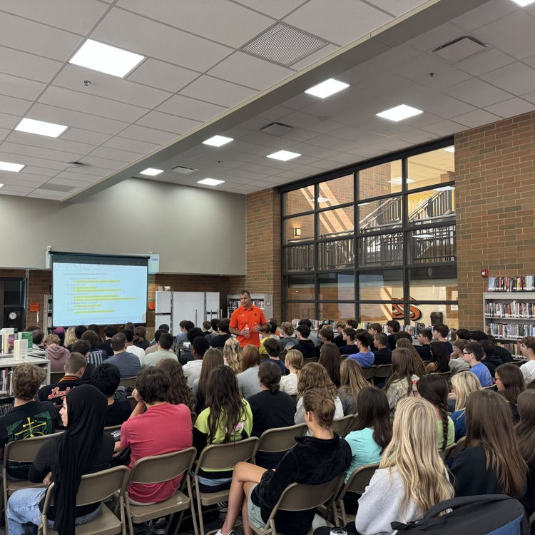 students in library at presentation