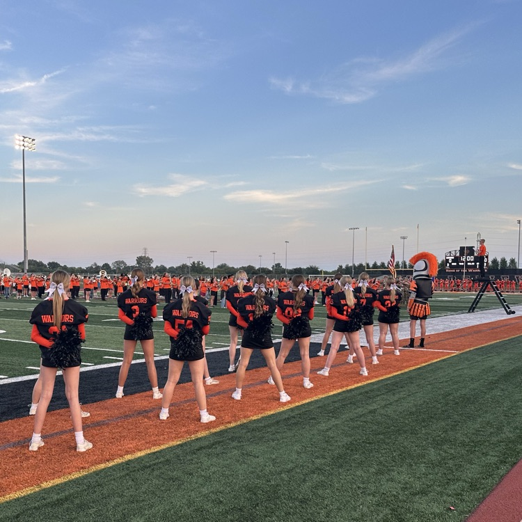 cheerleaders standing on the field prior to the start of the game