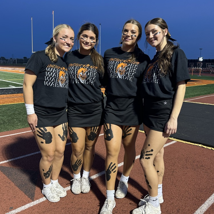 Senior cheerleaders posing for a photo