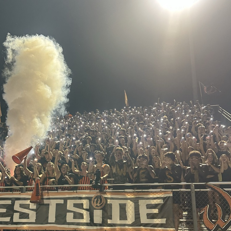 student section cheering at football game
