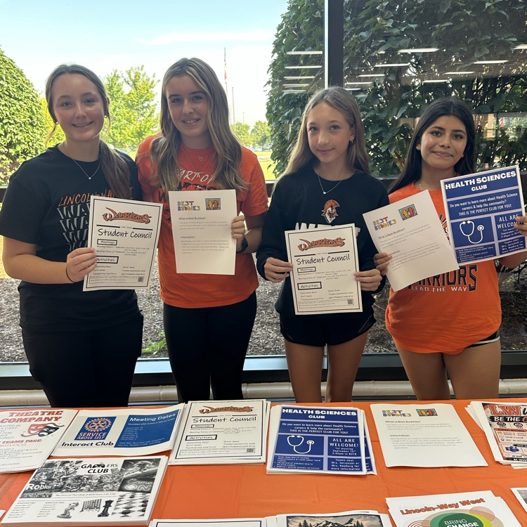 multiple students at the activity fair