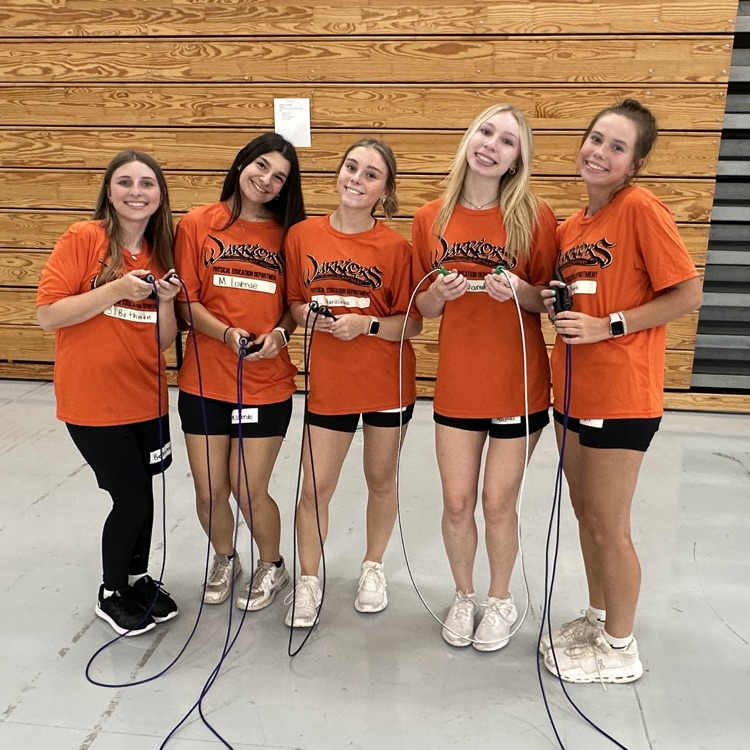 students holding jump ropes