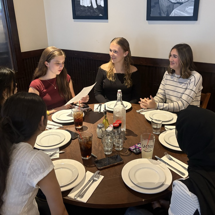 students discussing business etiquette