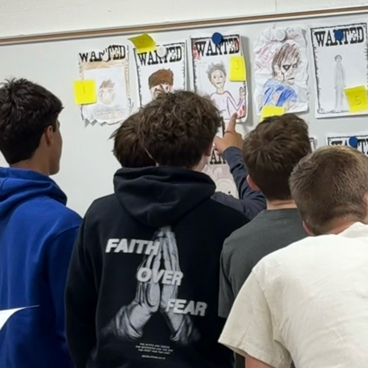 students looking at posters