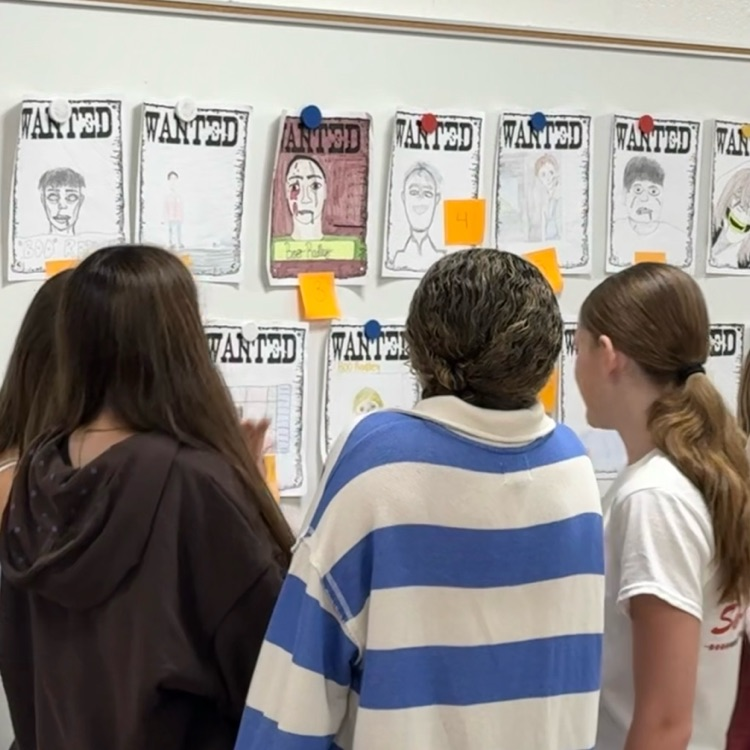 students looking at posters 