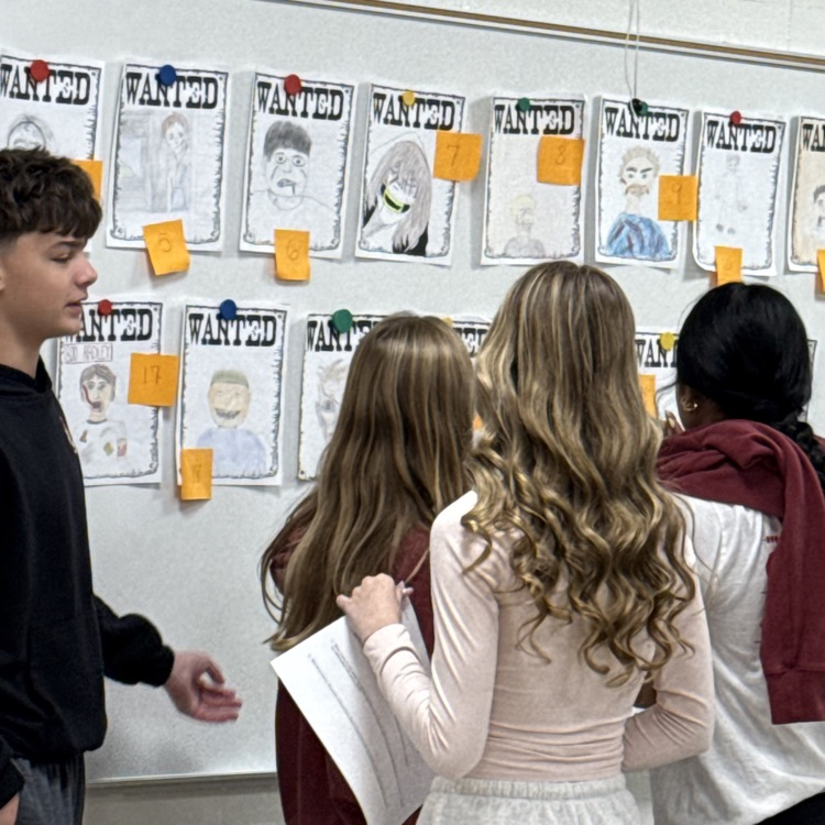 students looking at posters 