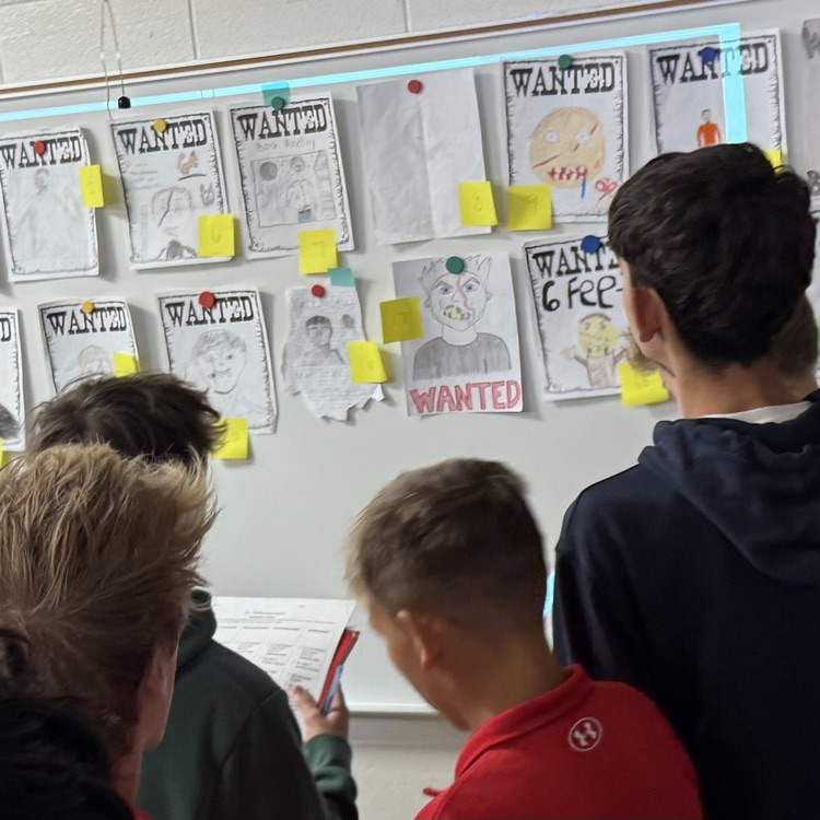 students looking at posters