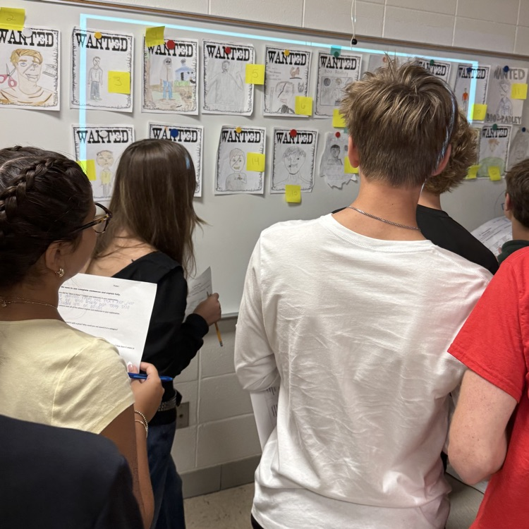 students looking at posters
