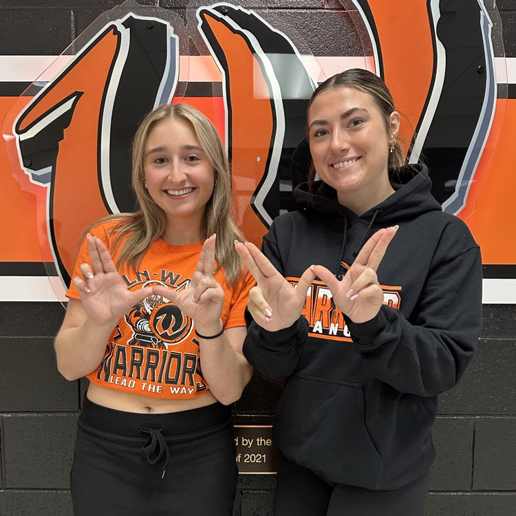 two students wearing school spirit wear