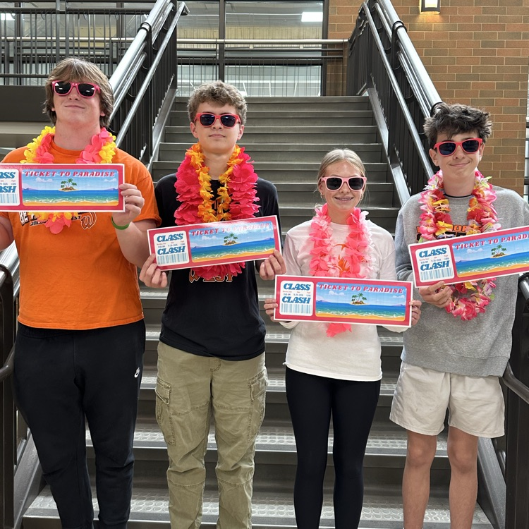 class presidents in tropical gear holding tickets