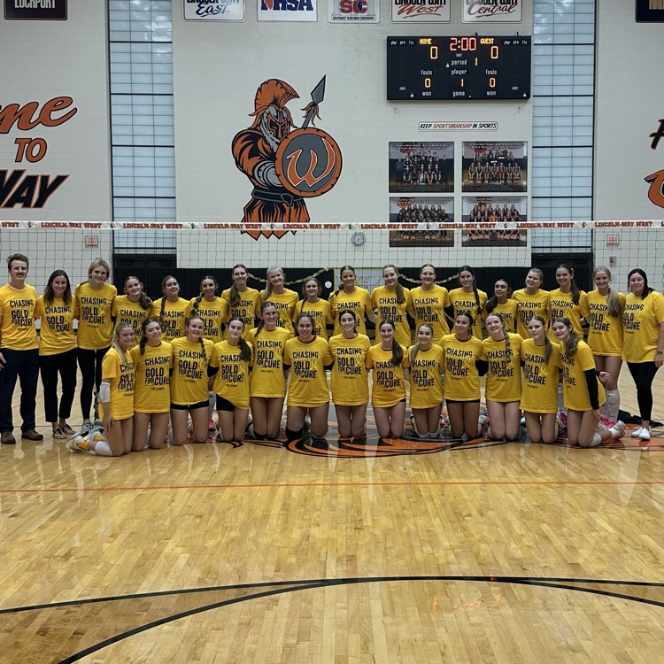 volleyball teams in gold shirts