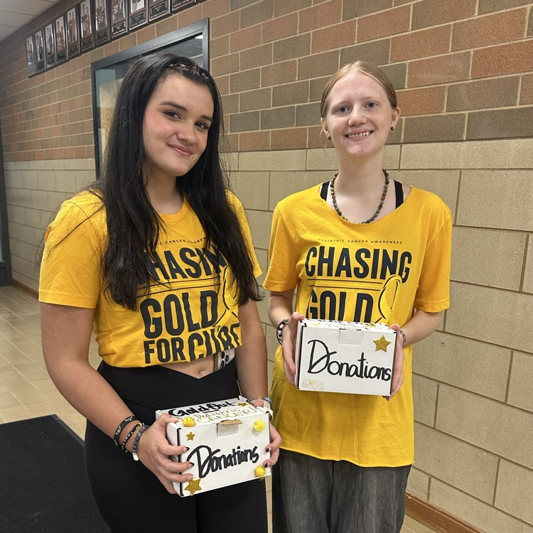 students in gold shirts