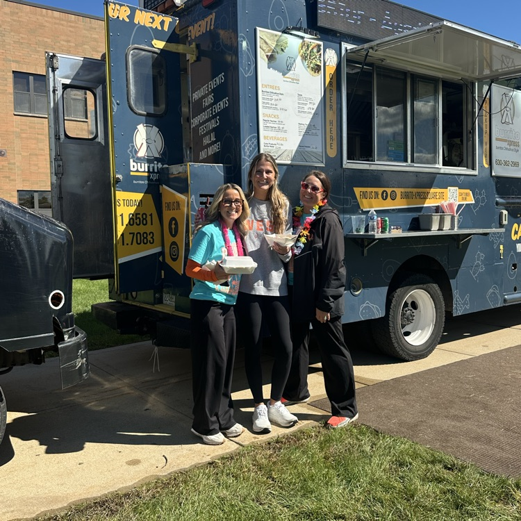 staff members in front of food truck