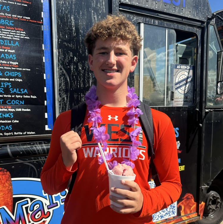 student in front of food truck