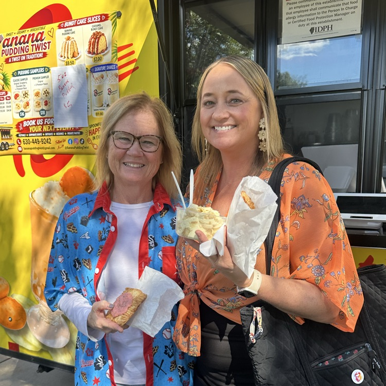 staff in front of food trucks