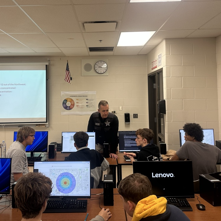 students working in groups at computers