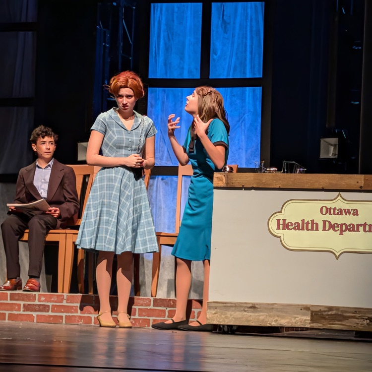 students acting on stage in Radium Girls