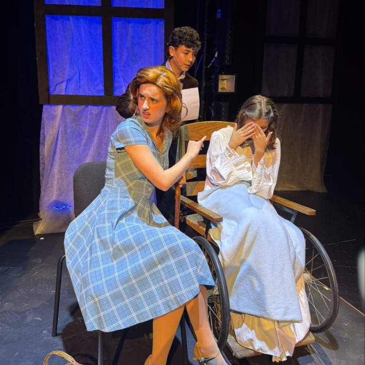 students acting on stage