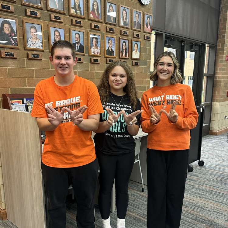 students wear school spirit wear in the library