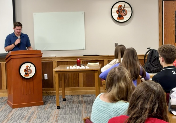 student reading at the podium