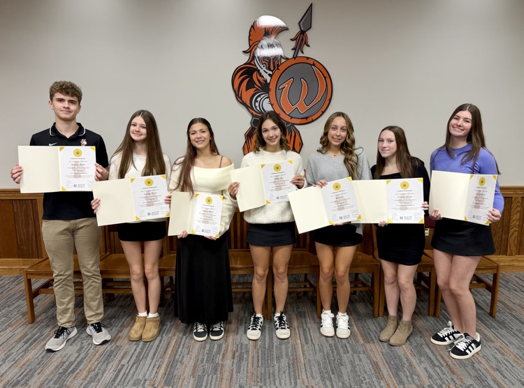 students holding certificates