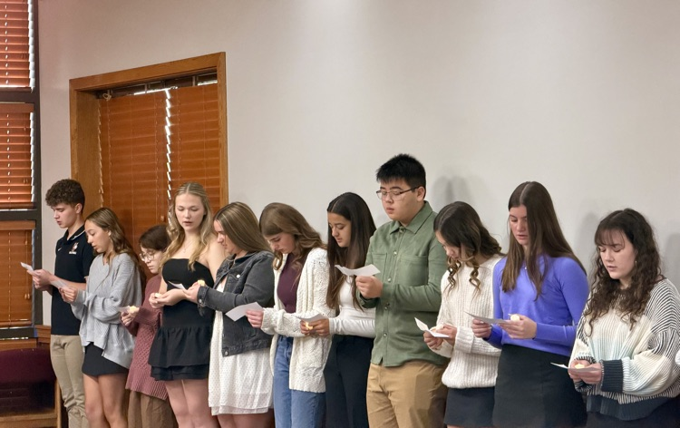 students reading at the induction