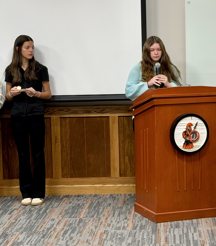 students at the podium