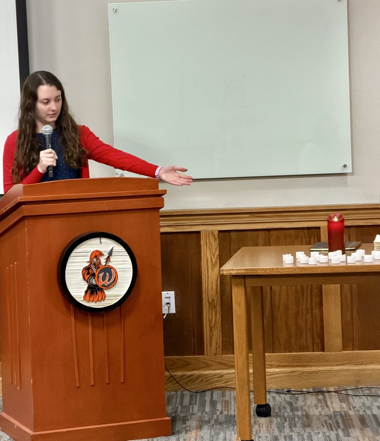 student at the podium