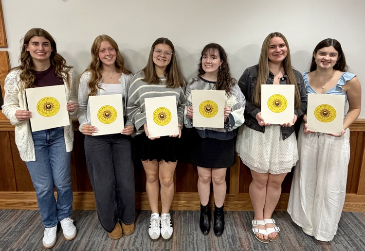 students holding certificates