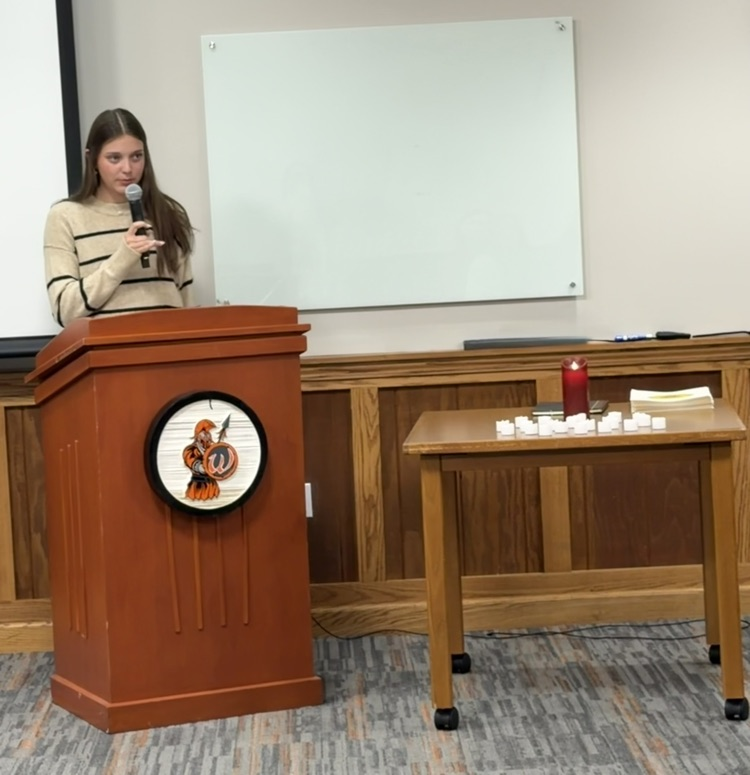 student reading at the podium