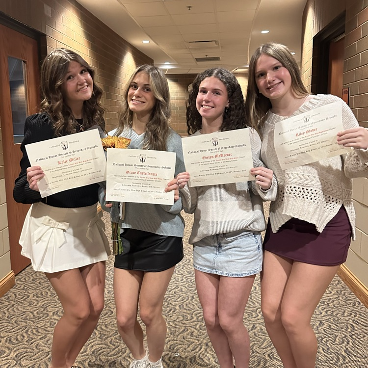 students posing for a photo with their certificates