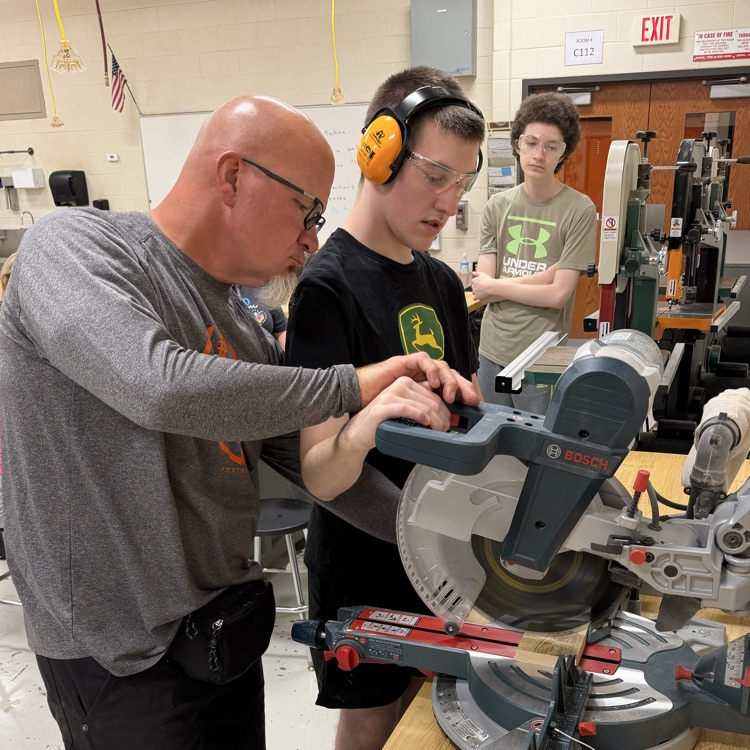teacher and student working at the equipment table