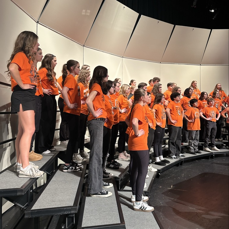 students practicing on stage