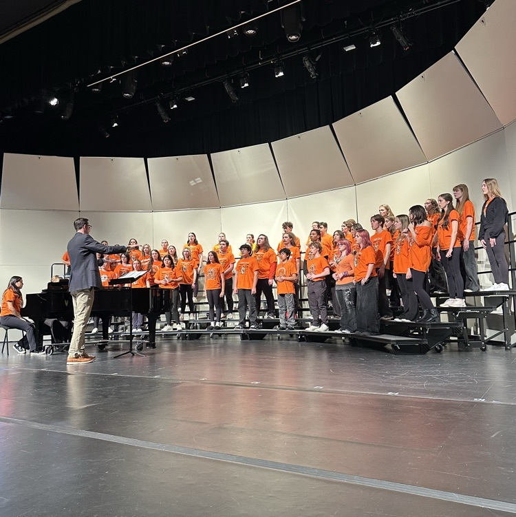 students singing on stage