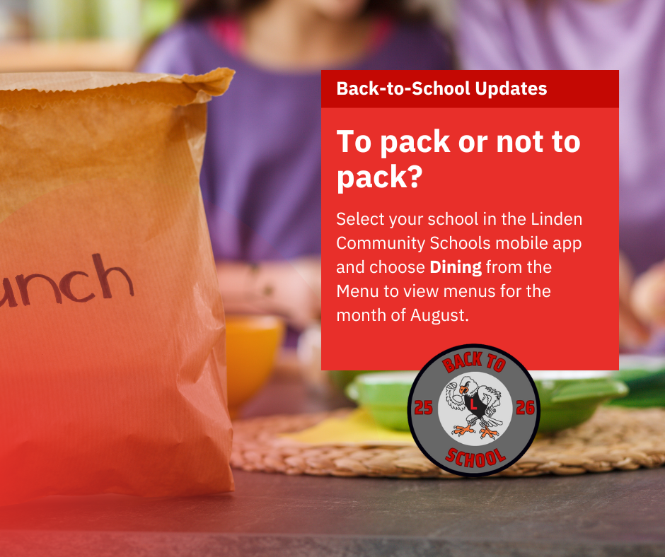 Student eating lunch from a brown paper lunch bag.