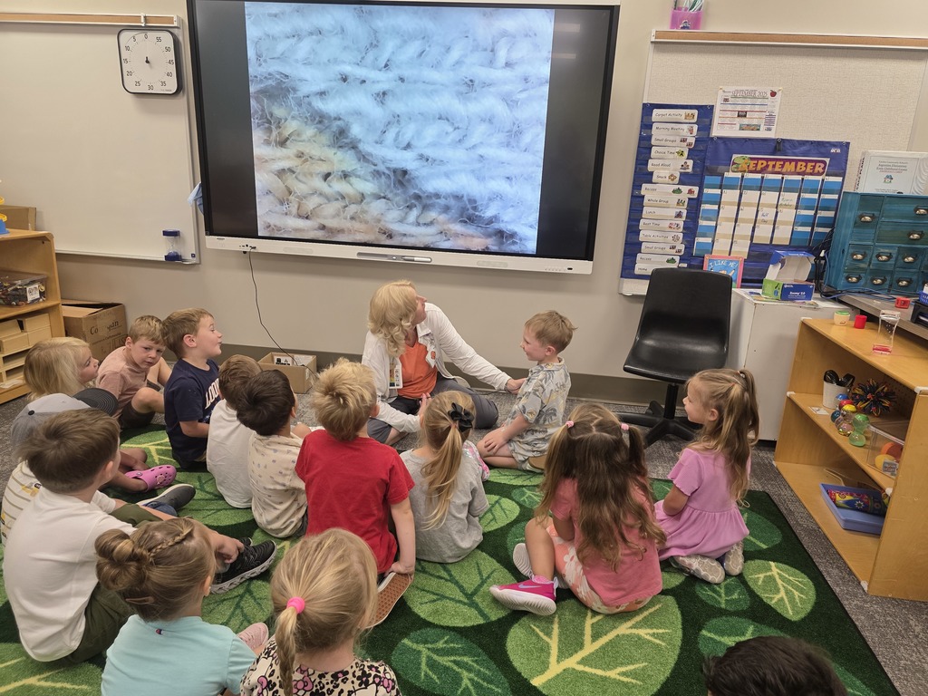 Mrs. Liss' preschool class had fun using a microscope to explore things more closely.  They were excited to see what different fabrics looked like.
