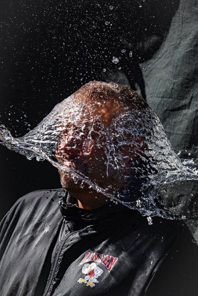 water balloon pop over person head