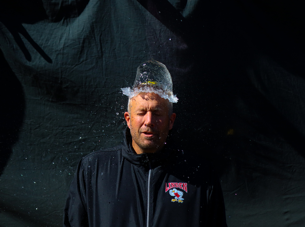 water balloon pop over person head