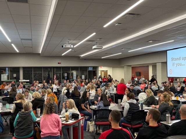 Linden teachers sitting at tables for professional development at EagleCon