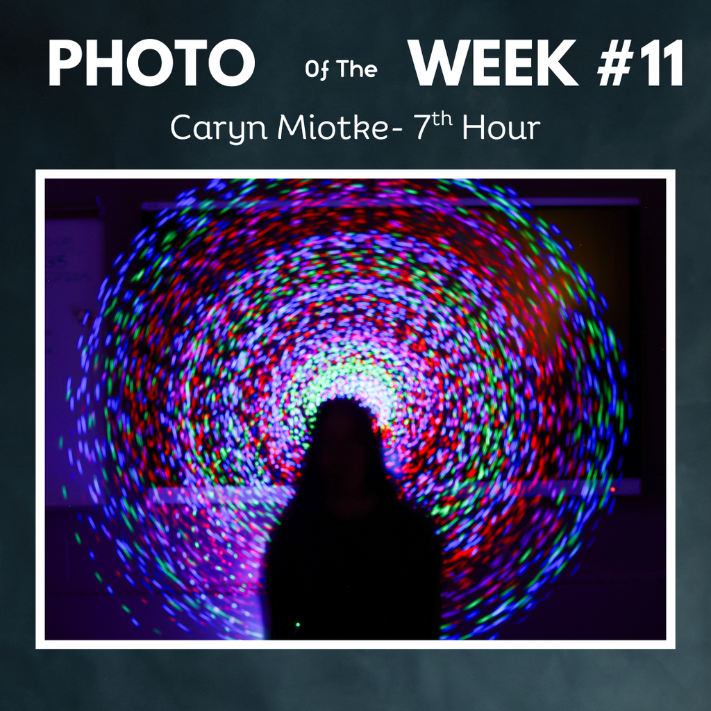3 photo of the week, silhouette of person with circle of lights in background caryn miotke
