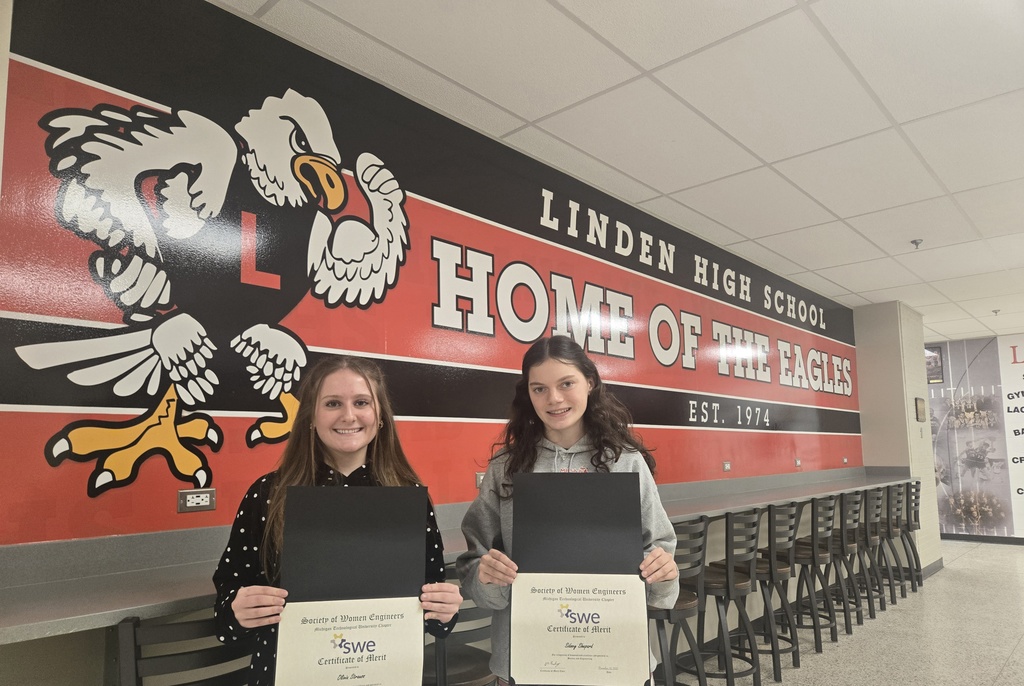  (Image is of Olivia Strauss and Sidney Shepard holding their certificates in front of Linden High School banner)
