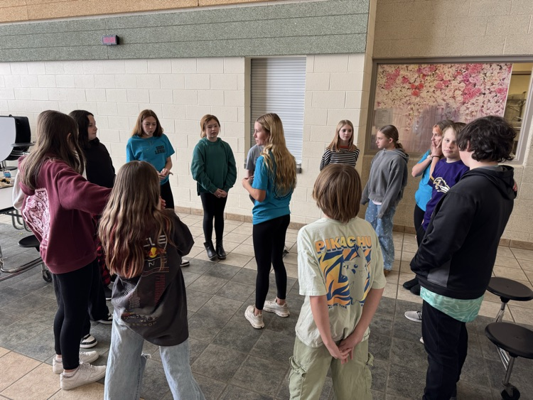 Group of students playing a game students playing Uno