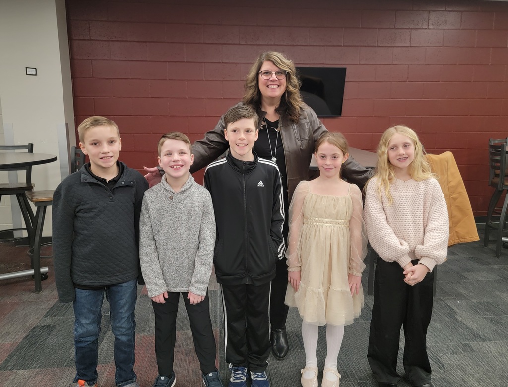 Female Principal with 5 elementary students; three boys and two girls