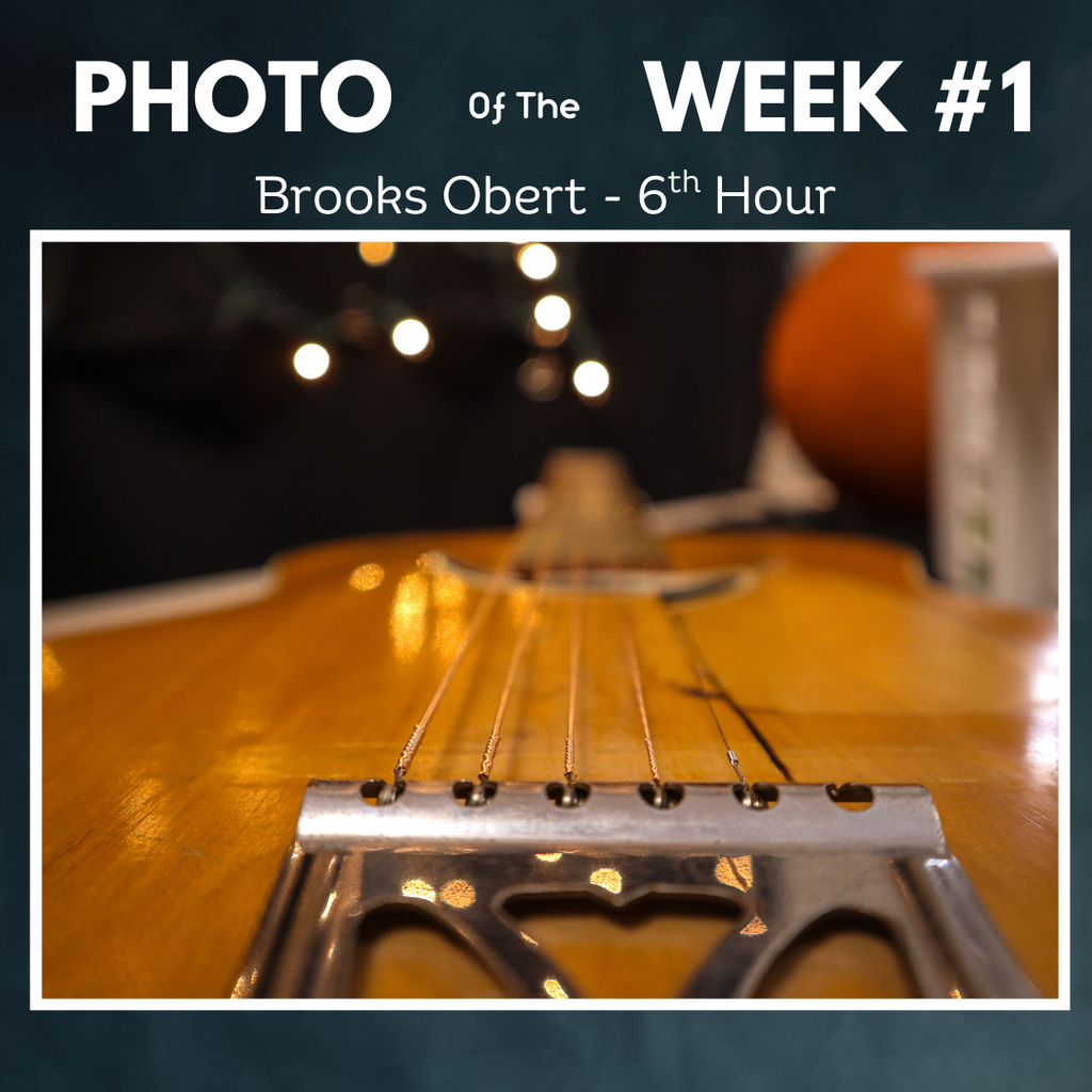 guitar strings close up with lights in background. - photo of the week 1 brooks obert